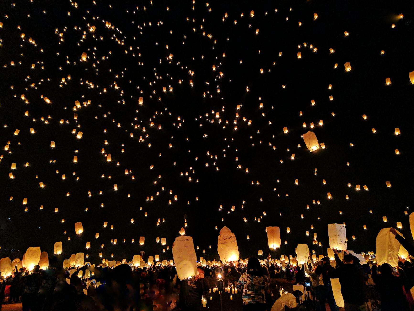 paper lanterns in the night sky