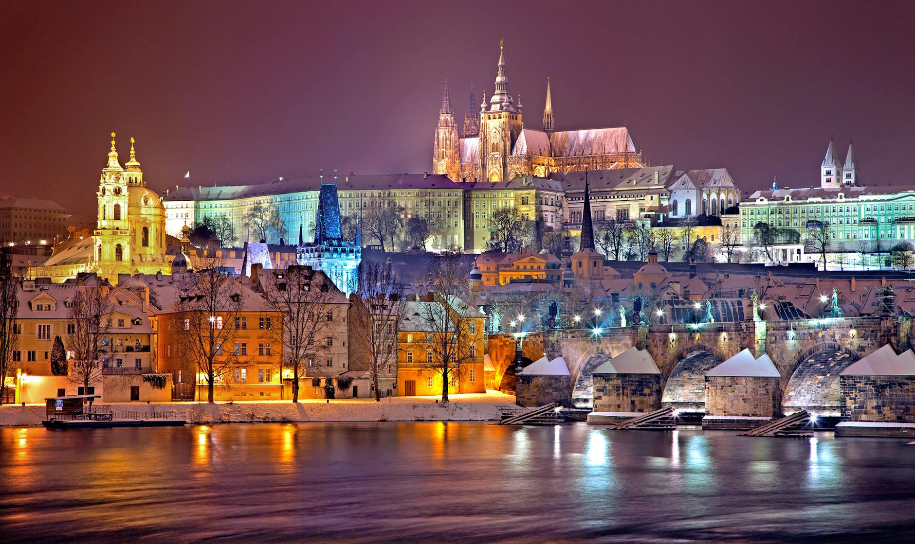 prague castle district lit up at night